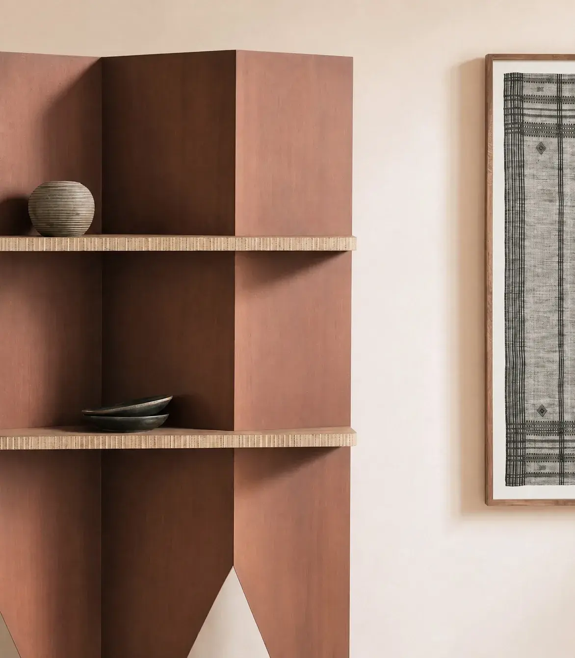 Terracotta wooden shelving with a ceramic vase and bowls